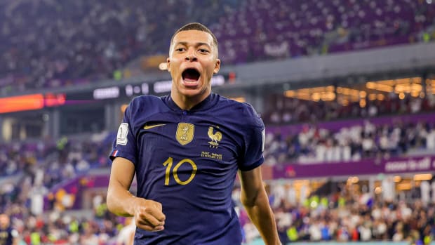 Kylian Mbappe pictured celebrating after scoring two goals for France against Denmark at the 2022 FIFA World Cup in Qatar